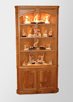 Oak corner cupboard with glass shelves